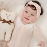 Bộ bodysuit sơ sinh La Pomme dài tay cổ viền ren hồng