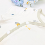 Bộ sơ sinh cộc tay cài lệch Bolly hoạ tiết